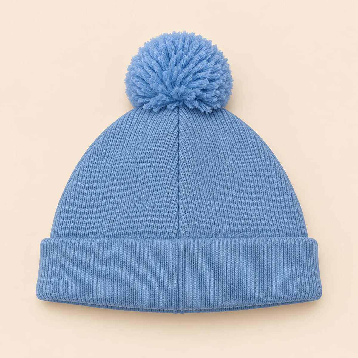 Gorro tejido para bebé azul con pompón