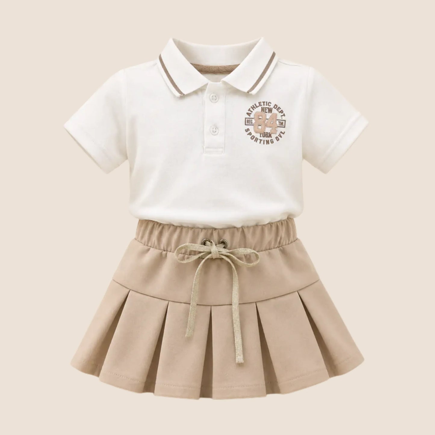 ⚪️ Conjunto 2 Piezas Niña | Polo Blanco Athletic + Falda Plisada Beige | Mara Baby