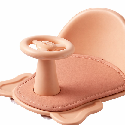 ASIENTO DE BAÑO PARA BEBE CON VOLANTE GIRATORIO - COLOR DURAZNO PASTEL