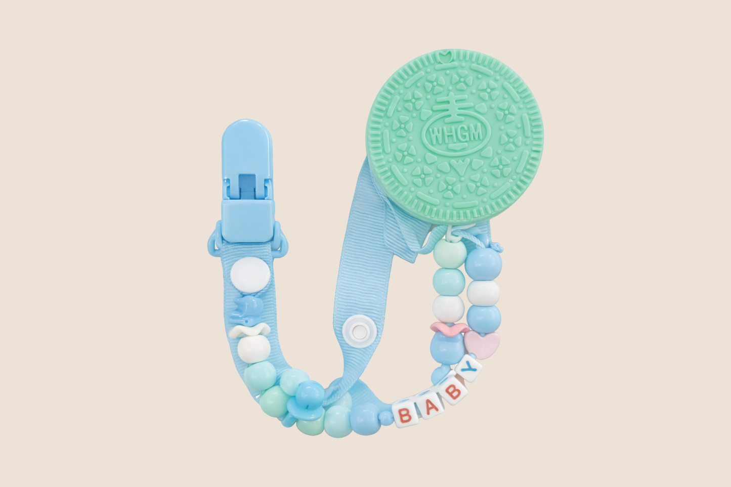 MORDEDERO EN SILICONA TIPO GALLETA + PORTA CHUPO CON CLIP DISEÑO - MODERNO EN TONOS CELESTES