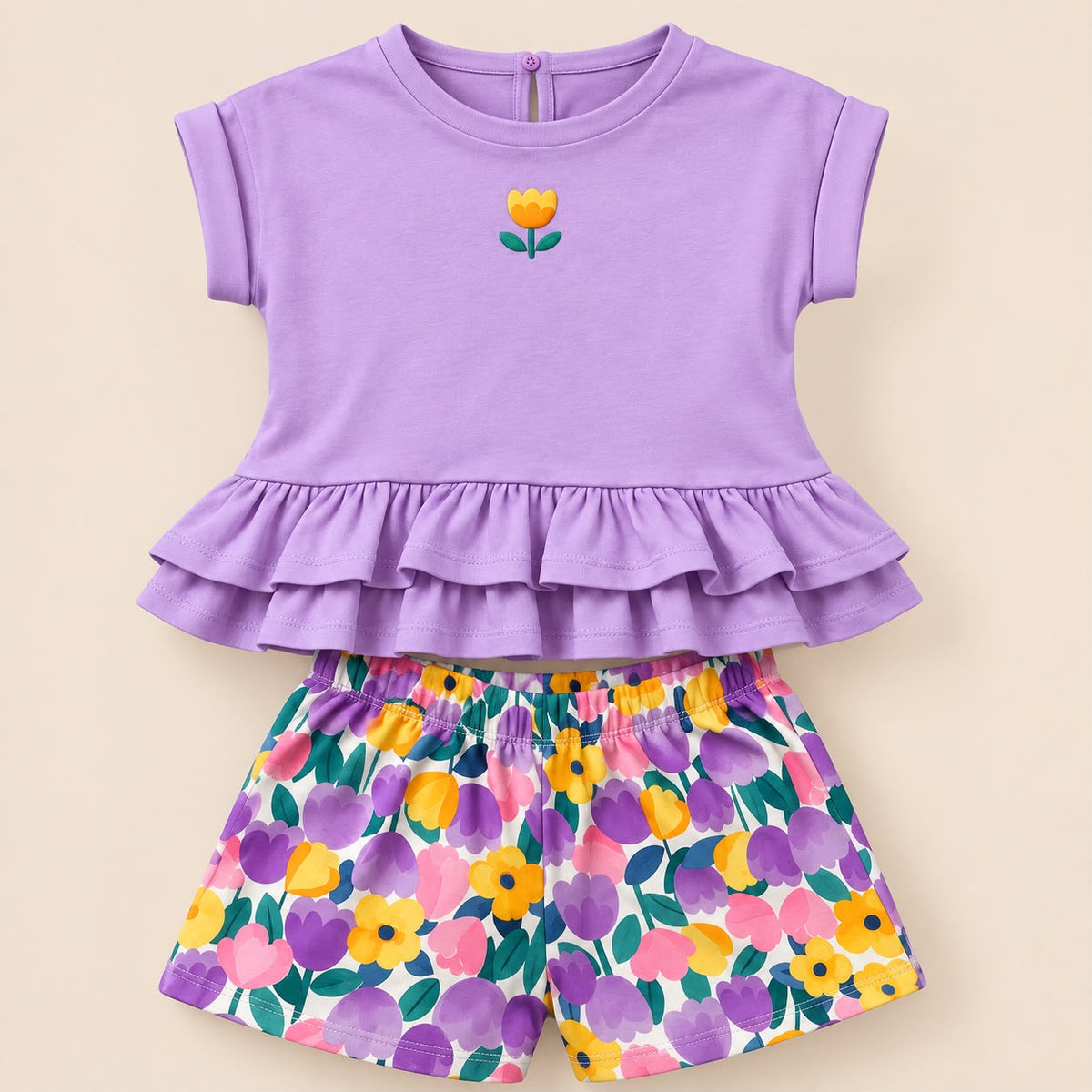 Conjunto para niña con blusa lila de doble volante y short estampado de flores