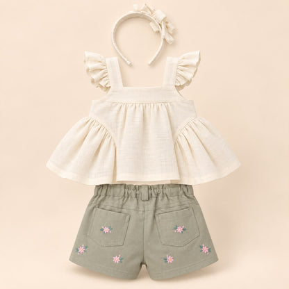 Conjunto bebé niña: blusa beige con moños, short verde salvia bordado floral y diadema a juego