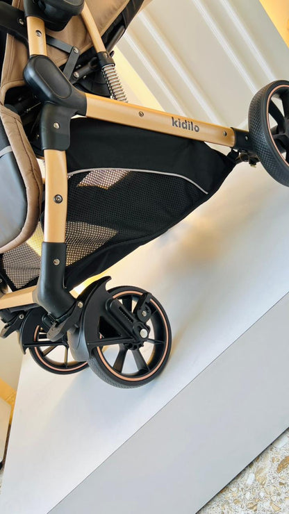 Coche Kidilo Coffee color café para bebé con capota y estructura dorada