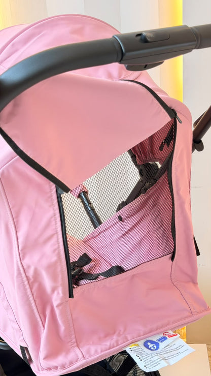 Coche para bebé plegable rosa con capota y canasta inferior