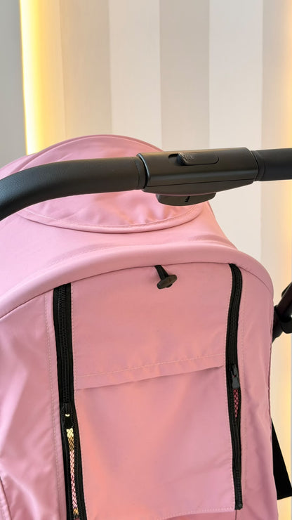 Coche para bebé rosa plegado para guardar y transportar