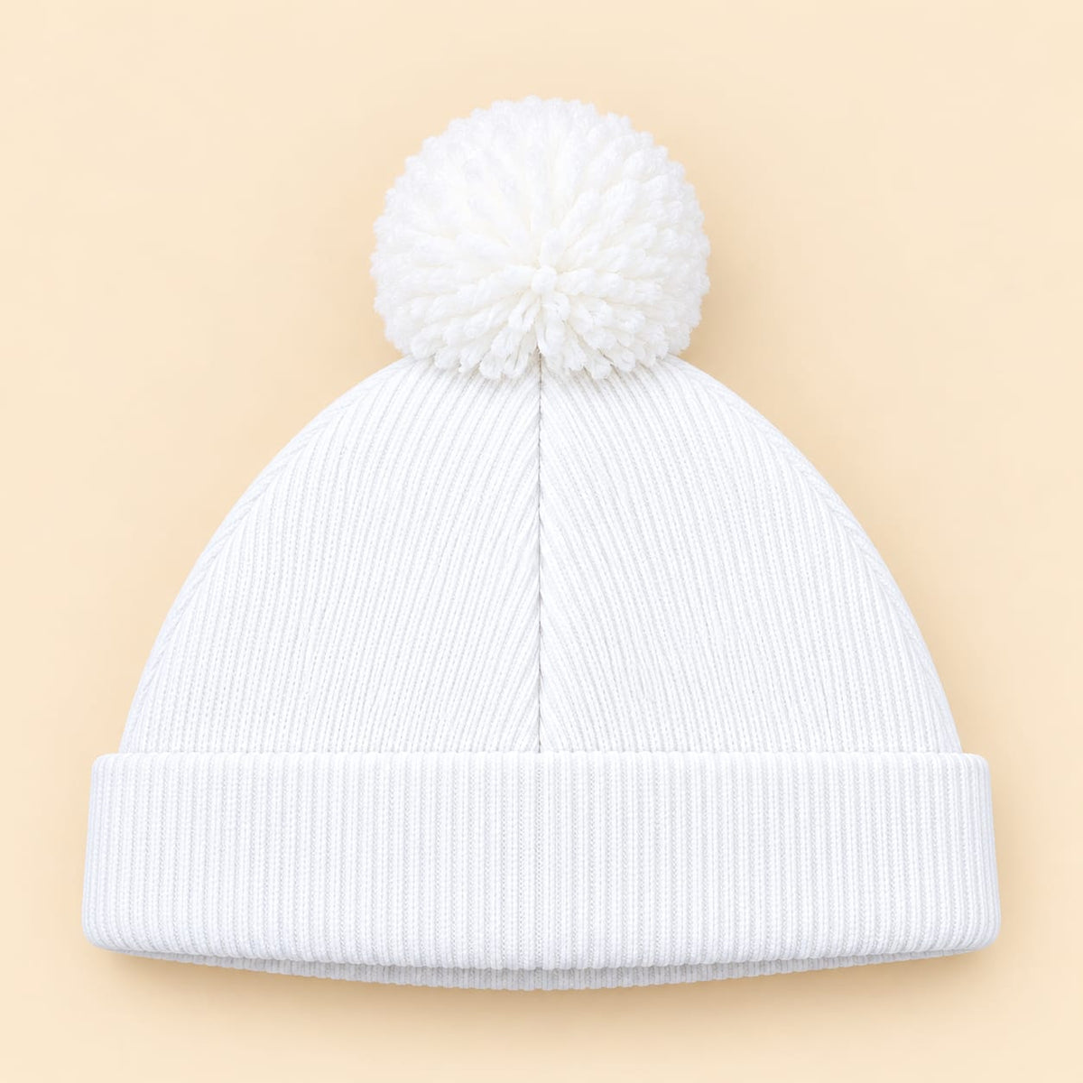 Gorro tejido para bebé blanco con pompón