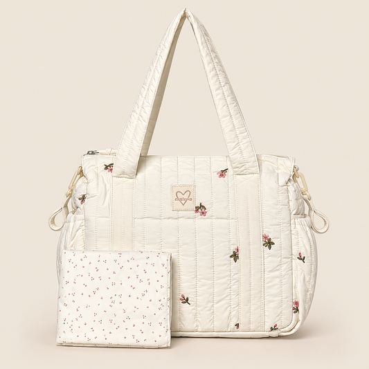 Pañalera para bebé crema acolchada con diseño floral, vista frontal